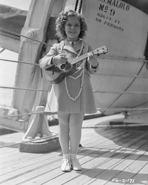 Shirley Temple Playing a Guitar