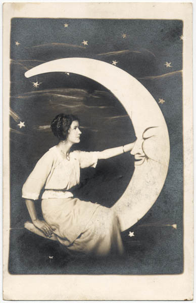 Woman in white on a paper moon