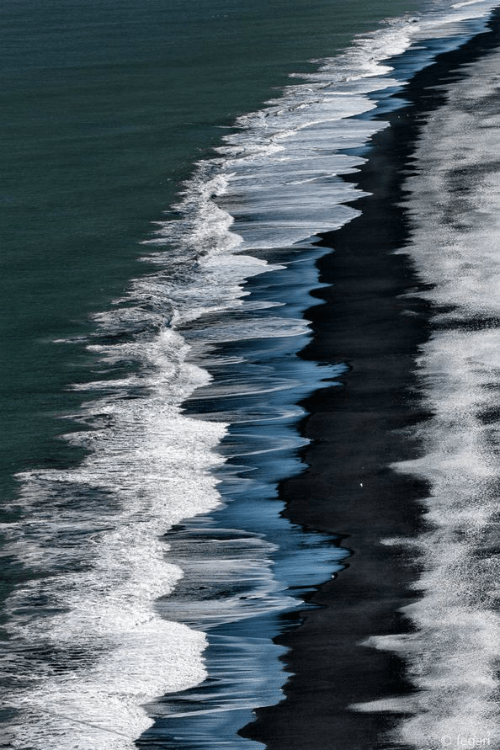 waves black sand beach