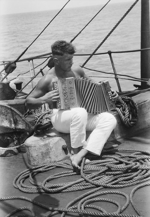 A sailor and his accordion onboard the Parma