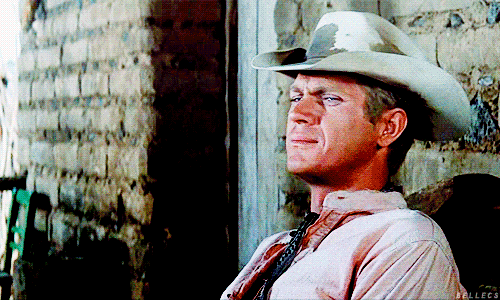 steve mcqueen cowboy wink GIF