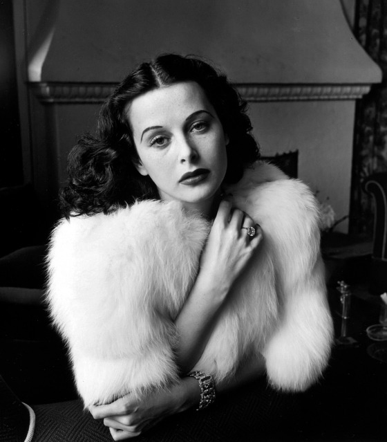Glamorous portrait of movie actress Hedy Lamarr wearing white fox fur short jacket.1938