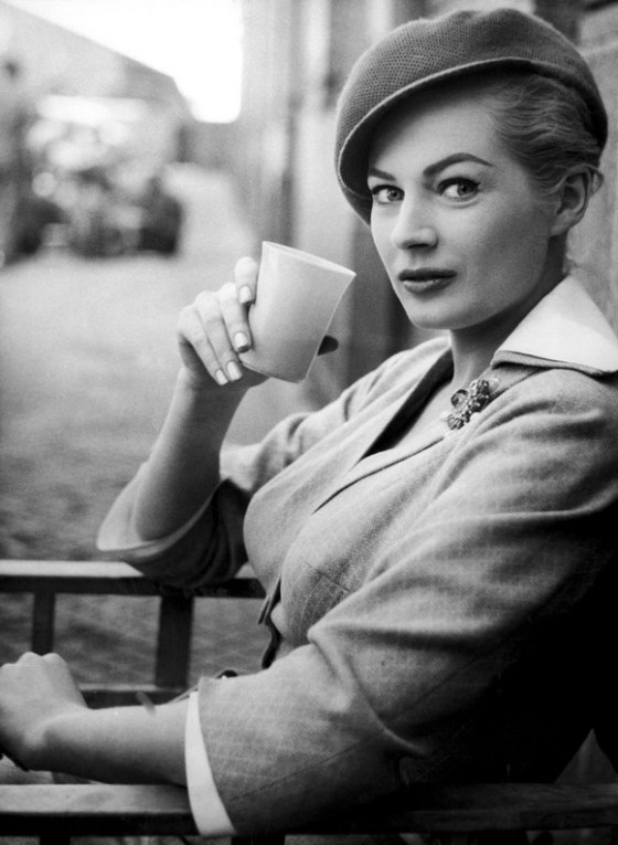 Swedish actress Anita Ekberg, wearing a chic cap-like beret and sipping a soft drink, relaxes during a break in the shooting of a scene for the Warwick films movie The Man Inside, in Madrid, Spain on May 7, 1958. Hollywood's Jack Palace also stars in the film, exteriors for which are being shot in Madrid. (AP Photo)