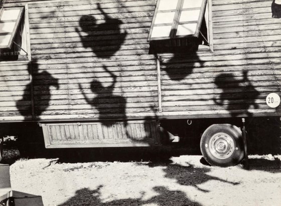 Jon Naar, Shadows of children on swings, Munich 1963.