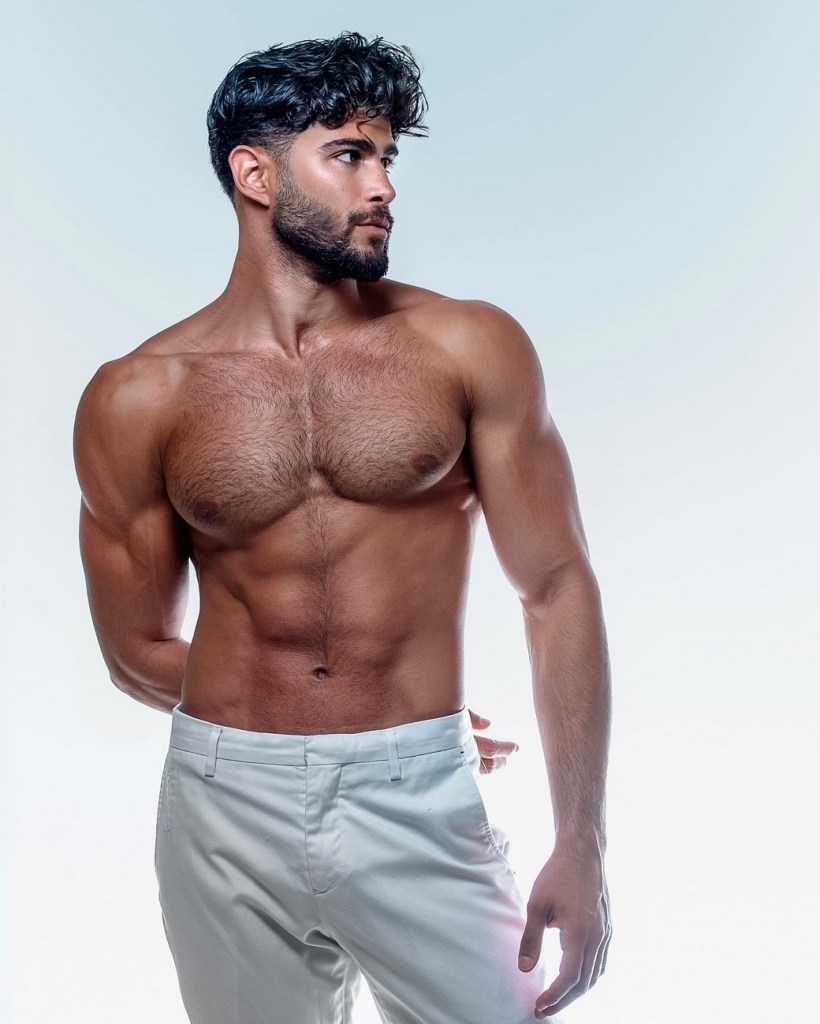 MODEL WEARING WHITE&nbsp;PANTS