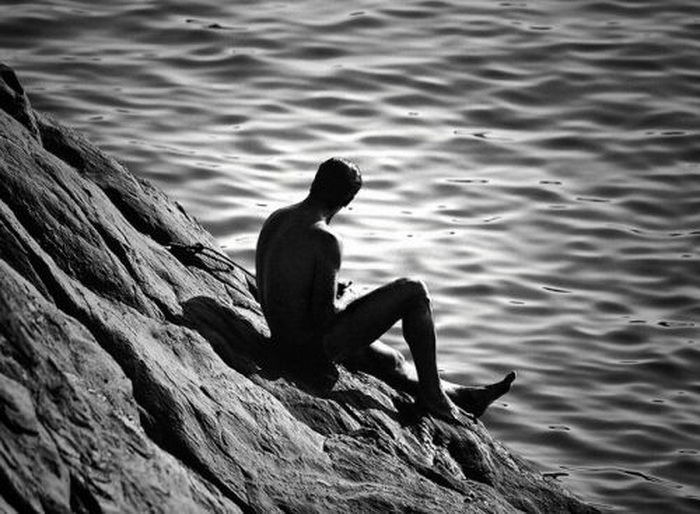 Sitting alone on the edge of the&nbsp;ocean