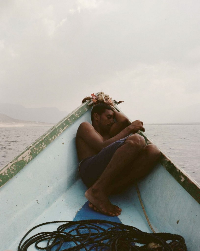 Fisherman taking a nap off the coast of Yemen, photo by Charles&nbsp;Thiefaine